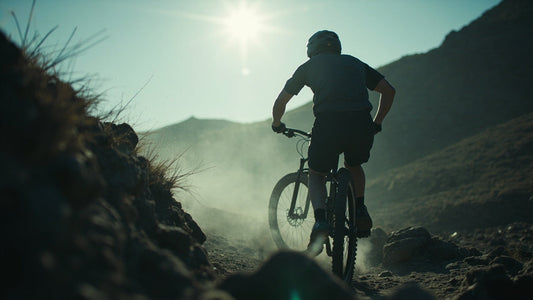 rear view rider on rocky trail wearing minimalist technical mtb apparel